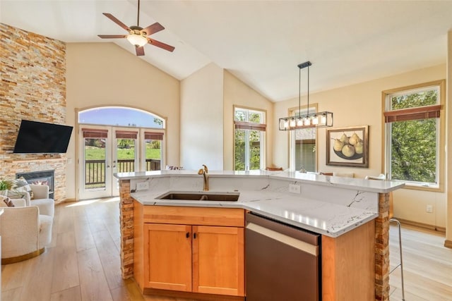620 Parkview Dr Unit 61, Steamboat Springs, CO 80487 - kitchen with dishwasher, a sink, open floor plan, plenty of natural light, and high vaulted ceiling