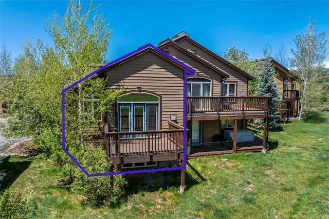 620 Parkview Dr Unit 61, Steamboat Springs, CO 80487 - rear view of property featuring a wooden deck and a lawn