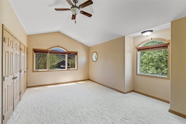 620 Parkview Dr Unit 61, Steamboat Springs, CO 80487 - carpeted empty room featuring a ceiling fan, healthy amount of natural light, vaulted ceiling, and baseboards