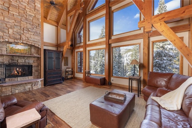 66 Chaparral Ln, Breckenridge, CO 80424 - living room featuring wood finished floors, a fireplace, high vaulted ceiling, and a wood ceiling with exposed beams