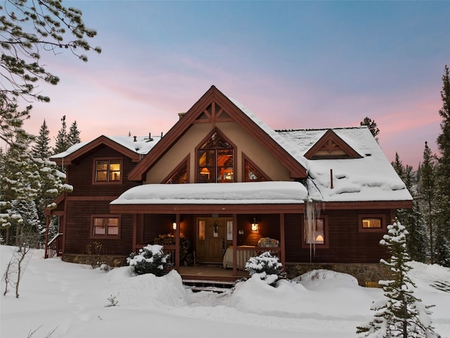 66 Chaparral Ln, Breckenridge, CO 80424 - snow covered rear of property with covered porch