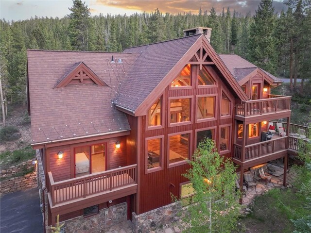 66 Chaparral Ln, Breckenridge, CO 80424 - snow covered house with stone siding and a garage