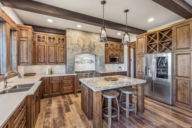 242 Point View Pl, Breckenridge, CO 80424 - kitchen with stainless steel appliances, a sink, beam ceiling, dark wood-style flooring, and tasteful backsplash