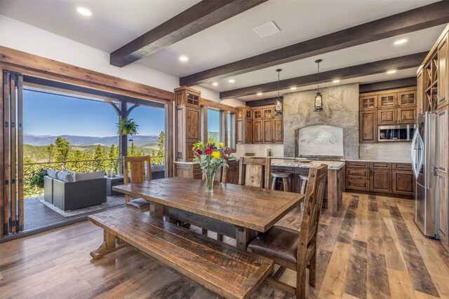 242 Point View Pl, Breckenridge, CO 80424 - dining space featuring dark wood-type flooring, plenty of natural light, beamed ceiling, a mountain view, and recessed lighting