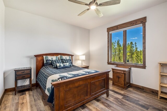242 Point View Pl, Breckenridge, CO 80424 - bedroom with baseboards, wood finished floors, and ceiling fan
