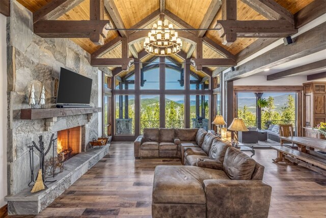 242 Point View Pl, Breckenridge, CO 80424 - living room with wooden ceiling with exposed beams, a chandelier, healthy amount of natural light, a fireplace, and high vaulted ceiling