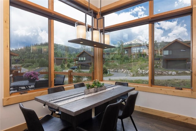 22 Vernon Way, Silverthorne, CO 80498 - dining area with wood finished floors and expansive windows