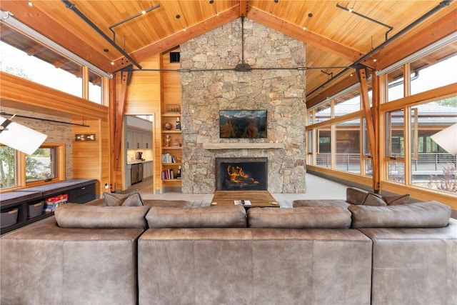 22 Vernon Way, Silverthorne, CO 80498 - living room with wooden ceiling, plenty of natural light, high vaulted ceiling, wooden walls, and a fireplace
