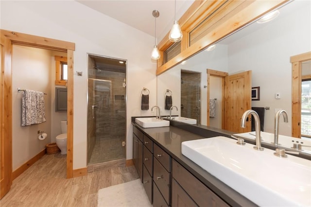 22 Vernon Way, Silverthorne, CO 80498 - bathroom featuring wood finished floors, double vanity, and a shower stall