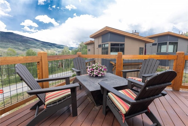 22 Vernon Way, Silverthorne, CO 80498 - wooden terrace with a mountain view and outdoor dining space