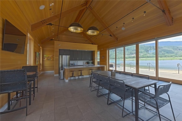 22 Vernon Way, Silverthorne, CO 80498 - dining room with wood walls, high vaulted ceiling, and a wood ceiling with exposed beams