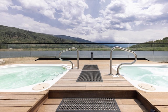 22 Vernon Way, Silverthorne, CO 80498 - view of swimming pool featuring a deck with mountain view and a sink