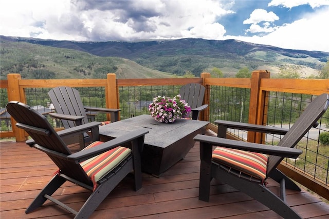 22 Vernon Way, Silverthorne, CO 80498 - wooden deck featuring a mountain view and outdoor dining area