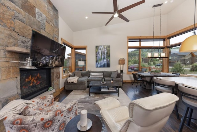 22 Vernon Way, Silverthorne, CO 80498 - living room featuring wood finished floors, high vaulted ceiling, a fireplace, a ceiling fan, and recessed lighting
