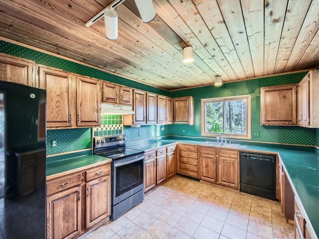 134 Hideaway Ct, Dillon, CO 80435 - kitchen with black appliances, wood ceiling, under cabinet range hood, backsplash, and light tile patterned floors