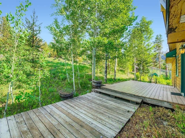 134 Hideaway Ct, Dillon, CO 80435 - wooden terrace with view of wooded area