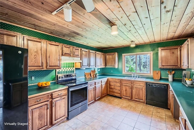 134 Hideaway Ct, Dillon, CO 80435 - kitchen with black appliances, wooden ceiling, under cabinet range hood, light tile patterned floors, and backsplash