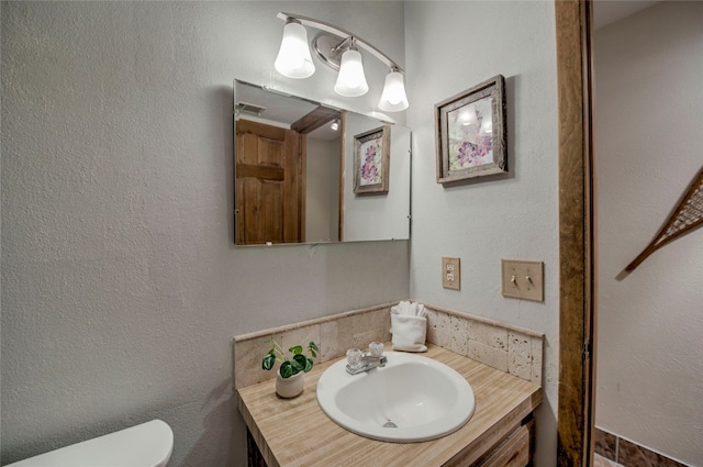 233 Burgundy Cir, Silverthorne, CO 80498 - bathroom featuring vanity and backsplash