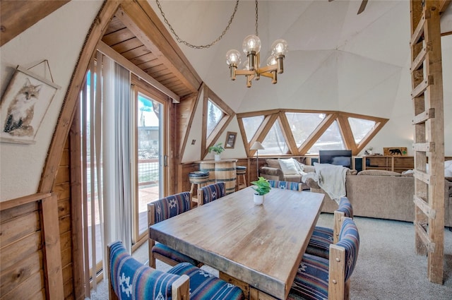 233 Burgundy Cir, Silverthorne, CO 80498 - dining room with carpet, a chandelier, and vaulted ceiling