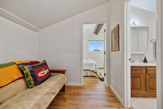726 Cumberland Dr, Jefferson, CO 80456 - sitting room with light wood finished floors and vaulted ceiling with beams