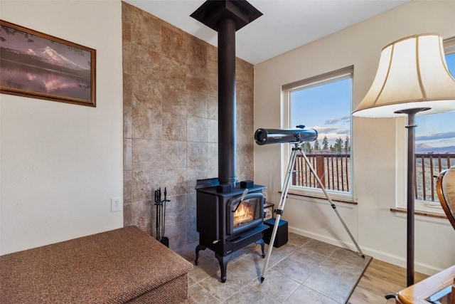 726 Cumberland Dr, Jefferson, CO 80456 - room details with baseboards and a wood stove