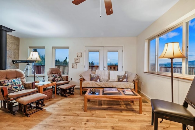 726 Cumberland Dr, Jefferson, CO 80456 - living area featuring light wood finished floors, french doors, and ceiling fan