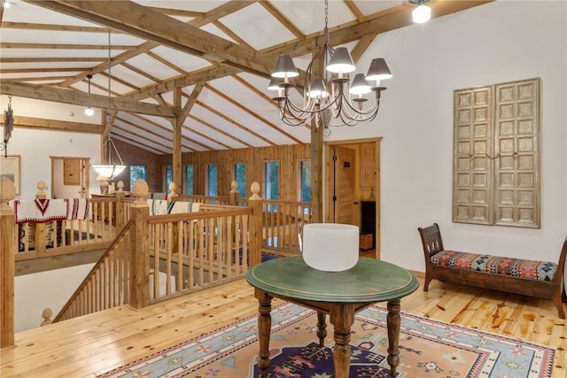 34074 Fruitland Mesa Rd, Crawford, CO 81415 - dining space with beamed ceiling, hardwood / wood-style flooring, high vaulted ceiling, and a notable chandelier