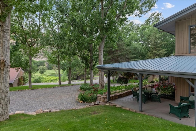 34074 Fruitland Mesa Rd, Crawford, CO 81415 - surrounding community with a gazebo, a patio area, and a lawn