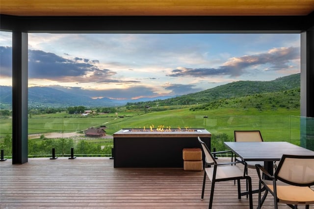 33200 Meadow Creek Dr, Steamboat Springs, CO 80487 - wooden terrace with a mountain view and outdoor dining space
