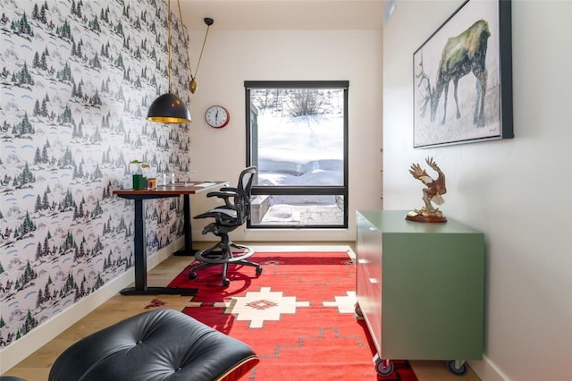33200 Meadow Creek Dr, Steamboat Springs, CO 80487 - office space with wallpapered walls, wood finished floors, and an accent wall