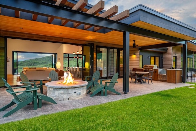 33200 Meadow Creek Dr, Steamboat Springs, CO 80487 - view of patio / terrace featuring an outdoor fire pit and ceiling fan