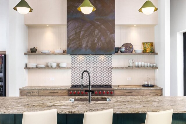33200 Meadow Creek Dr, Steamboat Springs, CO 80487 - kitchen featuring decorative backsplash, open shelves, light stone countertops, and pendant lighting