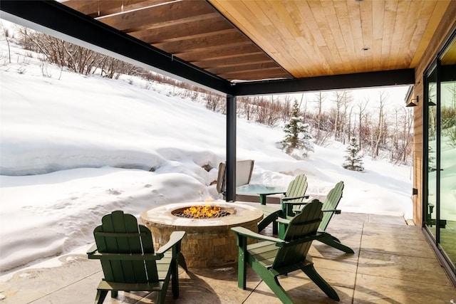 33200 Meadow Creek Dr, Steamboat Springs, CO 80487 - snow covered patio featuring an outdoor fire pit and a patio