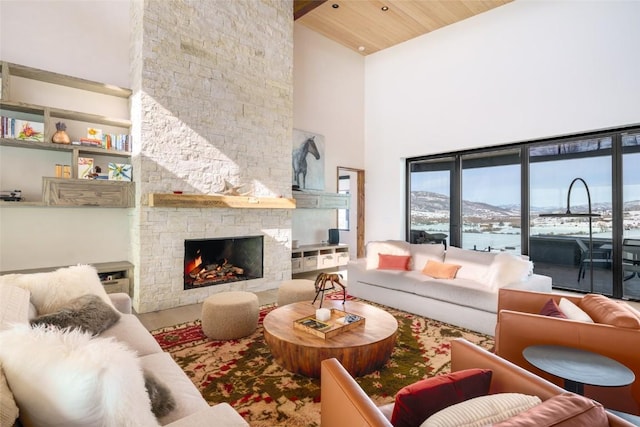 33200 Meadow Creek Dr, Steamboat Springs, CO 80487 - living room with high vaulted ceiling, a stone fireplace, plenty of natural light, and wood ceiling