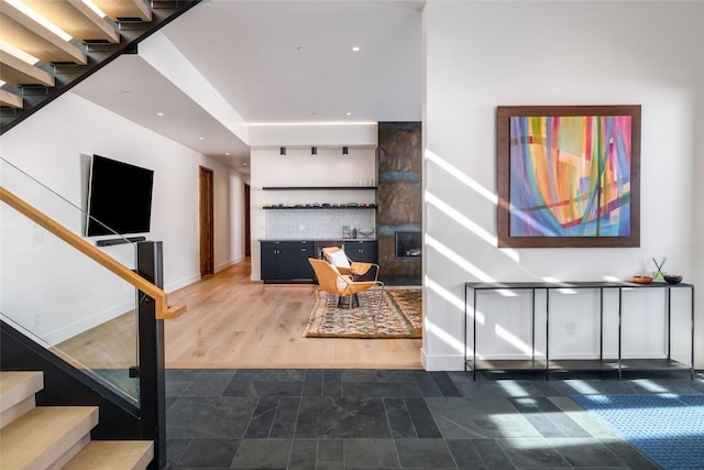 33200 Meadow Creek Dr, Steamboat Springs, CO 80487 - staircase featuring recessed lighting and stone finish flooring