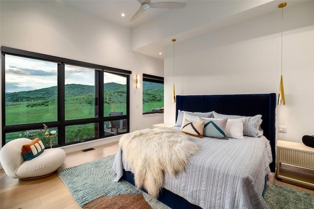 33200 Meadow Creek Dr, Steamboat Springs, CO 80487 - bedroom with recessed lighting, wood finished floors, a high ceiling, and ceiling fan