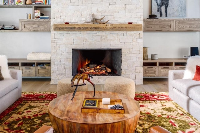 33200 Meadow Creek Dr, Steamboat Springs, CO 80487 - living area featuring wood finished floors and a lit fireplace