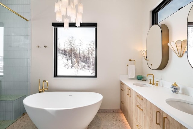 33200 Meadow Creek Dr, Steamboat Springs, CO 80487 - full bath with speckled floor, a freestanding bath, double vanity, and tiled shower
