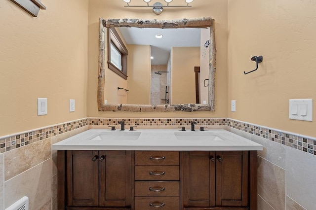 740 Cirrus Way, Granby, CO 80446 - full bath featuring tile walls, a sink, and wainscoting