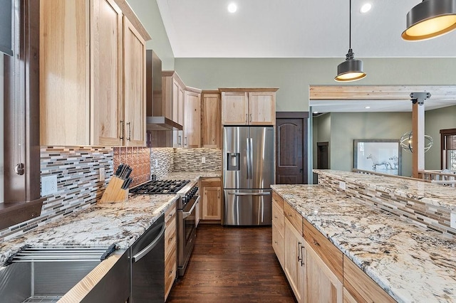 740 Cirrus Way, Granby, CO 80446 - kitchen with backsplash, wall chimney range hood, light stone countertops, light brown cabinets, and appliances with stainless steel finishes