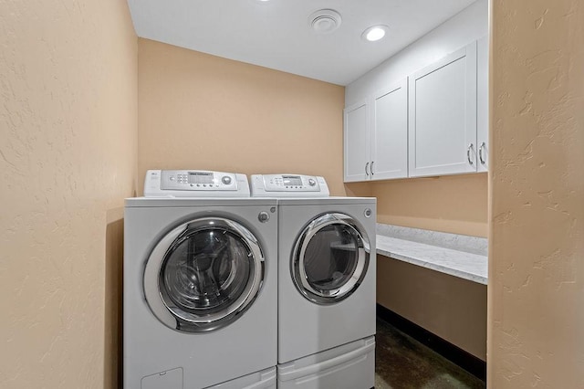 740 Cirrus Way, Granby, CO 80446 - laundry room with a textured wall, cabinet space, and washer and clothes dryer