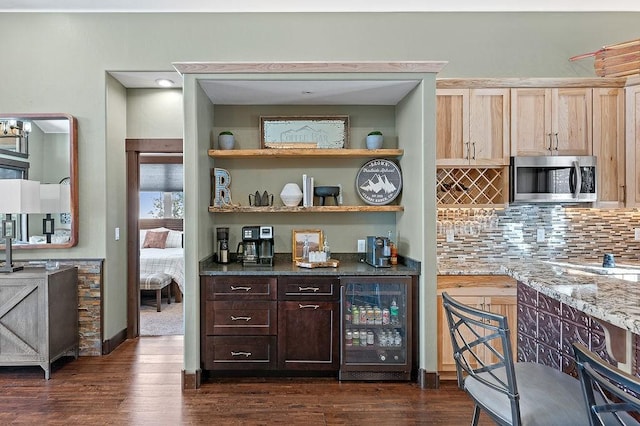 740 Cirrus Way, Granby, CO 80446 - kitchen with stainless steel microwave, dark wood-style floors, decorative backsplash, and wine cooler