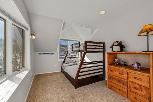 carpeted bedroom featuring lofted ceiling