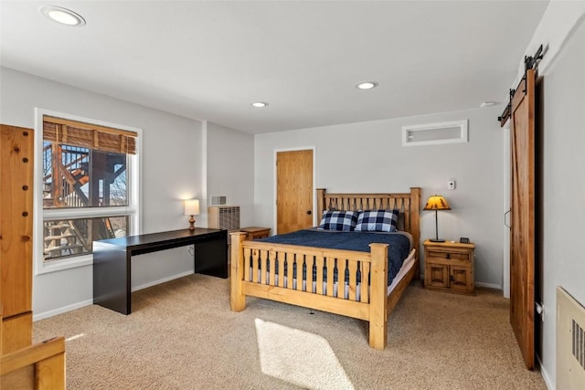 carpeted bedroom featuring radiator heating unit and a barn door