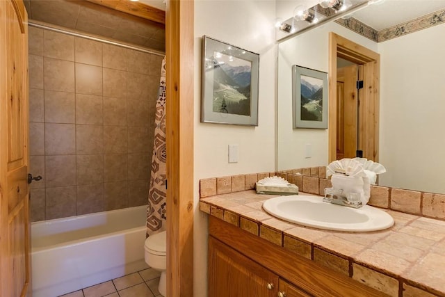bathroom with shower / bath combination with curtain, vanity, tile patterned flooring, and toilet