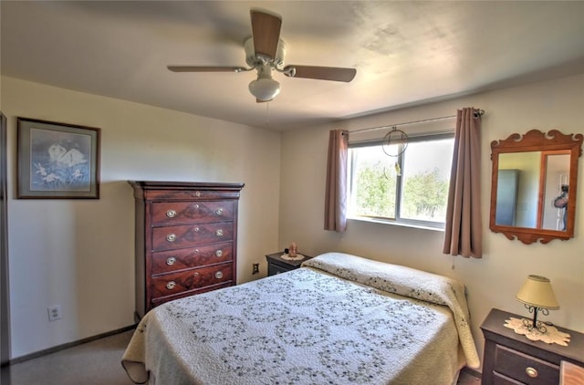 carpeted bedroom featuring baseboards and ceiling fan