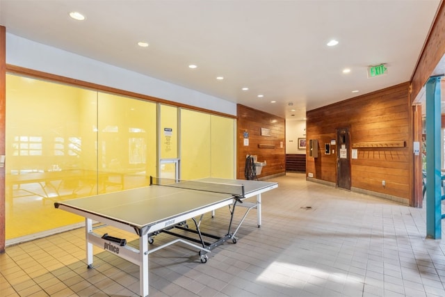 playroom featuring recessed lighting, wood walls, and light tile patterned floors