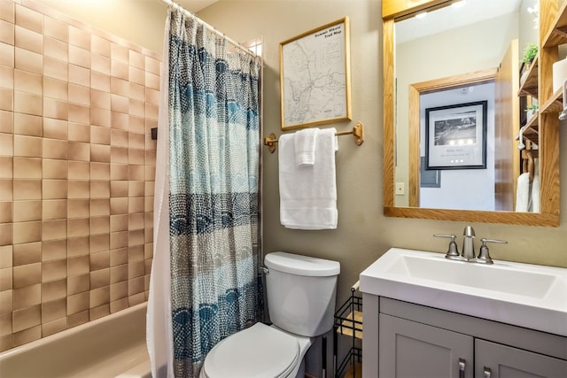 full bath with toilet, shower / bath combo with shower curtain, and vanity