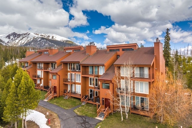 view of building exterior featuring a mountain view