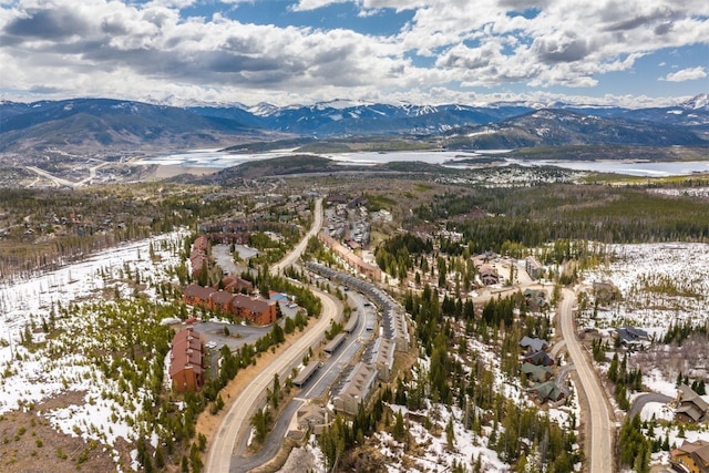 snowy aerial view featuring a mountain view